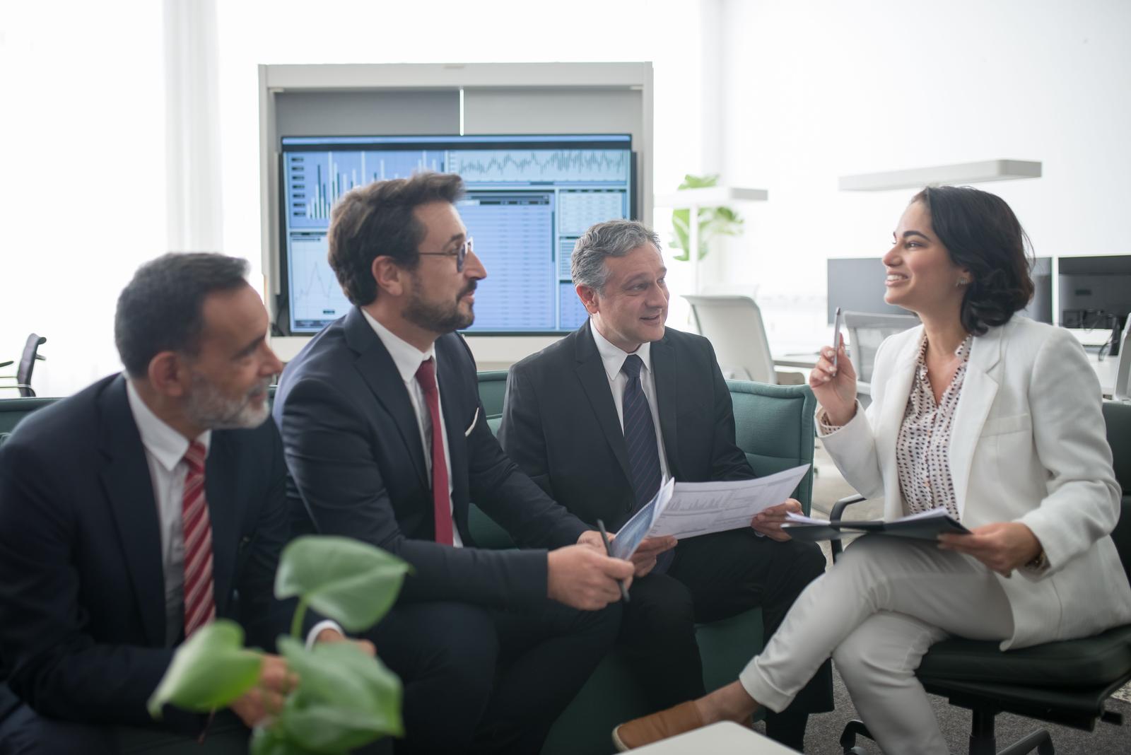 A consultative team discussing project requirements and business goals directly.